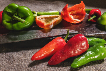 Sticker - Closeup shot of colorful peppers on cut board