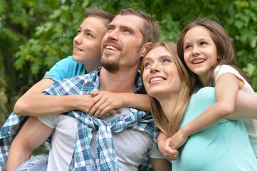 Sticker - Portrait of happy young family in summer  park