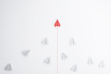Leadership Concept With Red Paper Plane Going Ahead White Paper Planes On Abstract Light Background