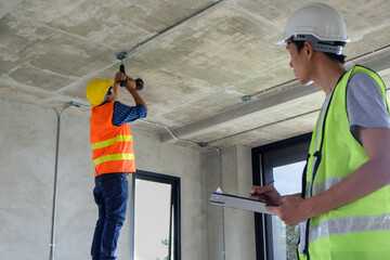 Worker or inspector auditor inspect and check worker quality safety standard control during working with checklist