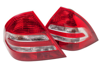 Wall Mural - A pair of taillights of a stop signal for a German auto - optical equipment of white and red color on a white isolated background. A spare part for repair and sale in a car service center.