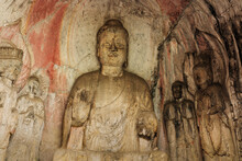 Carved Buddha Limestone At Longmen Grottoes Or Caves (Dragon Gate Grottoes), The World Heritage Site In Luoyang, Henan Province, China.