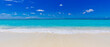 © icemanphotos - Closeup of sand on beach and blue summer sky. Panoramic beach landscape. Empty tropical beach and seascape. Vacation coast, shore blue sky, soft sand, calmness, tranquil relaxing sunlight, summer mood