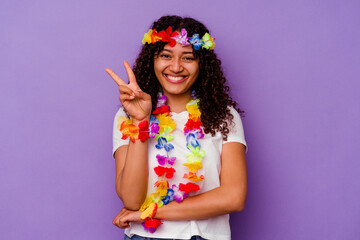 Wall Mural - Young Hawaiian woman isolated on purple background showing number two with fingers.