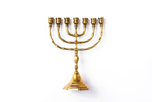 Golden Hanukkah Menorah On Isolated On White Background. Jewish Holiday Banner With Copy Space. Ancient Ritual Religious Candle Menorah