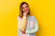 © Asier - Young caucasian skinny woman isolated on yellow background smiling happy and confident, touching chin with hand.
