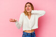 © Asier - Young caucasian woman isolated on pink background screaming with rage.