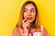 © Asier - Young caucasian woman wearing invisible orthodontics isolated on yellow background