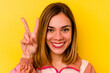 © Asier - Young caucasian woman wearing invisible orthodontics isolated on yellow background
