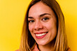 © Asier - Young caucasian woman wearing invisible orthodontics isolated on yellow background
