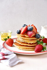 Wall Mural - Hot homemade delicious pancake with fresh strawberry and honey.