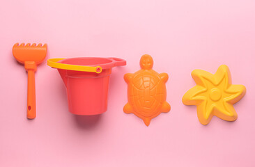 Set of beach toys for children on color background