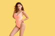 © Pixel-Shot - Beautiful young woman in swimsuit on color background