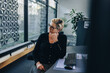 © Jacob Lund - Stressed businesswoman relaxing at her desk
