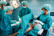 © NDABCREATIVITY - Group of surgeon team at work in operating room in hospital