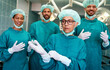 © NDABCREATIVITY - Successful team of surgeon standing in operating room, ready to work on a patient