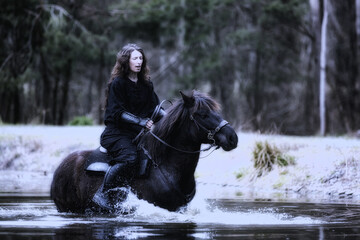 Wall Mural - beautiful black dressed woman in historical costume rides a horse on water, monochrome glamor