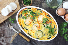 French Cuisine. Vegetable Zucchini Clafoutis With Goat Cheese In Ceramic Bakeware