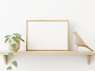 Poster - Small horizontal wooden frame mockup in scandi style interior with trailing green plant in pot, bird and shelf on empty neutral white wall background. A4, A3 format. 3d rendering, illustration