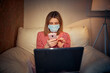 © ZaStock - Young european woman wearing surgical face mask stay at home dur