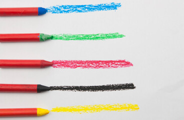 Poster - Kid's drawn rainbow and colorful crayons on white background