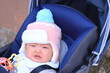 © Potos - ベビーカーで泣いている赤ちゃん