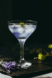 Fototapeta Na sufit - Lavander coctail on dark and moody background.