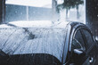 © Chanakon - Heavy rain fell on the roof of the car. Driving on rainy days, be careful driving.