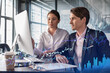 © VideoFlow - Businessman and businesswoman in formal wear working together to optimize trading strategy at corporate finance fund. Forex chart hologram over office background with panoramic windows