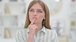 © stockbakers - Portrait of Pensive Young Woman Thinking about Something