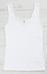 Wall Mural - White tank top back view tshirt template mock up on white wooden background top view.
