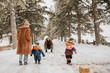 © Image Source RF - Canada, Ontario, Parents with children on winter walk