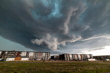 USA, Colorado, Colorado Springs, Tornadic Storm Clouds Over Apartment Blocks
