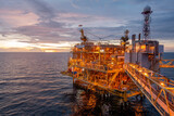 Fototapeta  - Offshore oil and gas central processing platform in sun set which produce raw gas, crude and hydrocarbon then sent to onshore refine, petrochemical industry. Power and energy business.