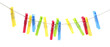 Colorful plastic clothespins hanging on rope against white background
