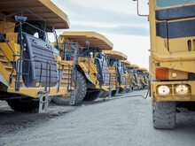 UK, Doncaster, Row Of Industrial Vehicles At Open Cast Coal Mine