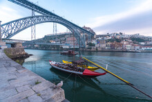 Portugal, Porto, Rabelo Boats On Douro River With Dom Lus I Bridge In Background