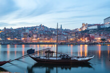 Portugal, Porto, Traditional Rabelo Boats On Douro River At Dusk