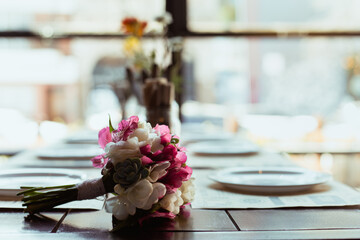 Wedding table setting. Close-up of flowers bouquet bride's. Concept of engagement, happiness and celebration