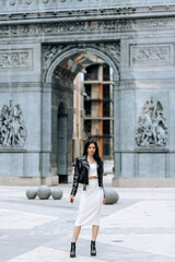 Wall Mural - Young beautiful brunette fashionable outfit walking in the city