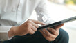 © chinnarach - close up businessman hand use digital tablet to touchscreen by unlock password on electronic wallet with virtual interface for futuristic technology and finance concept