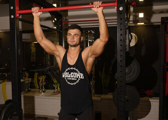 Wall Mural - Fitness man warming up in gym.