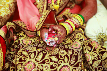 Poster - Hands of bride is decorated beautifully by indian mehndi art along with jewelery’s and colorful bangles