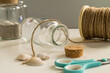 Handmade glass diy project. With scissors, cord and shellfish. Creative diy concept.