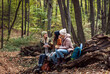 © Zoran Zeremski - Three female friends having fun and enjoying hiking in forest.