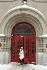 Wall Mural - Old door of Zavarskaya-Troitsky's profitable house in Potapovsky Lane, 12, Moscow city, Russia. Russian girl in folk Pavlovo Posad shawl. Moscow landmark, monument