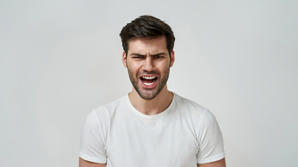 Wall Mural - Young bearded man wearing t-shirt shouting