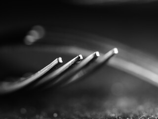 Wall Mural - Closeup shot of metal forks on a black surface