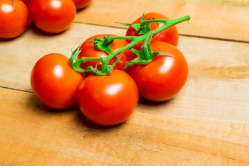 Wall Mural - red tomatoes arranged on raw boards.