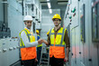 © visoot - Electrical engineers handshaking in power plant control room,Successful deal after work.